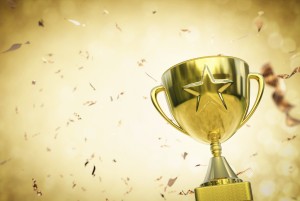 gold star trophy on gold background